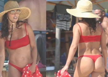 JULIANA PAES OUSA DE BIQUININHO VERMELHO E USA BOLSA DE R$ 7 MIL NA PRAIA