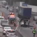 Acidente na Avenida Brasil envolvendo uma moto, uma carreta e um carro.